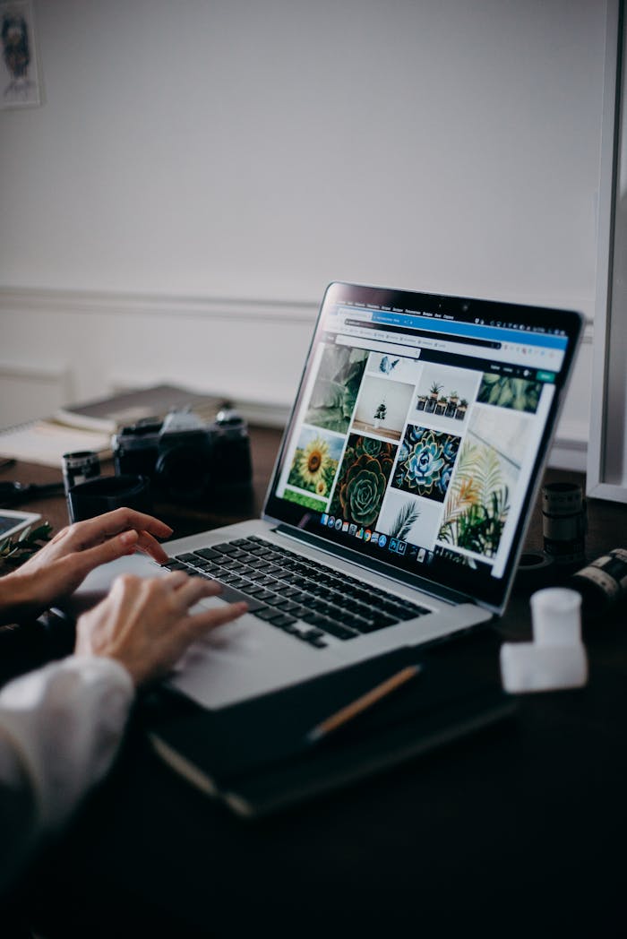 Mastering the First Impression: Your intriguing post title goes here A creative workspace featuring a laptop displaying a gallery of images, ideal for digital nomads and remote work.